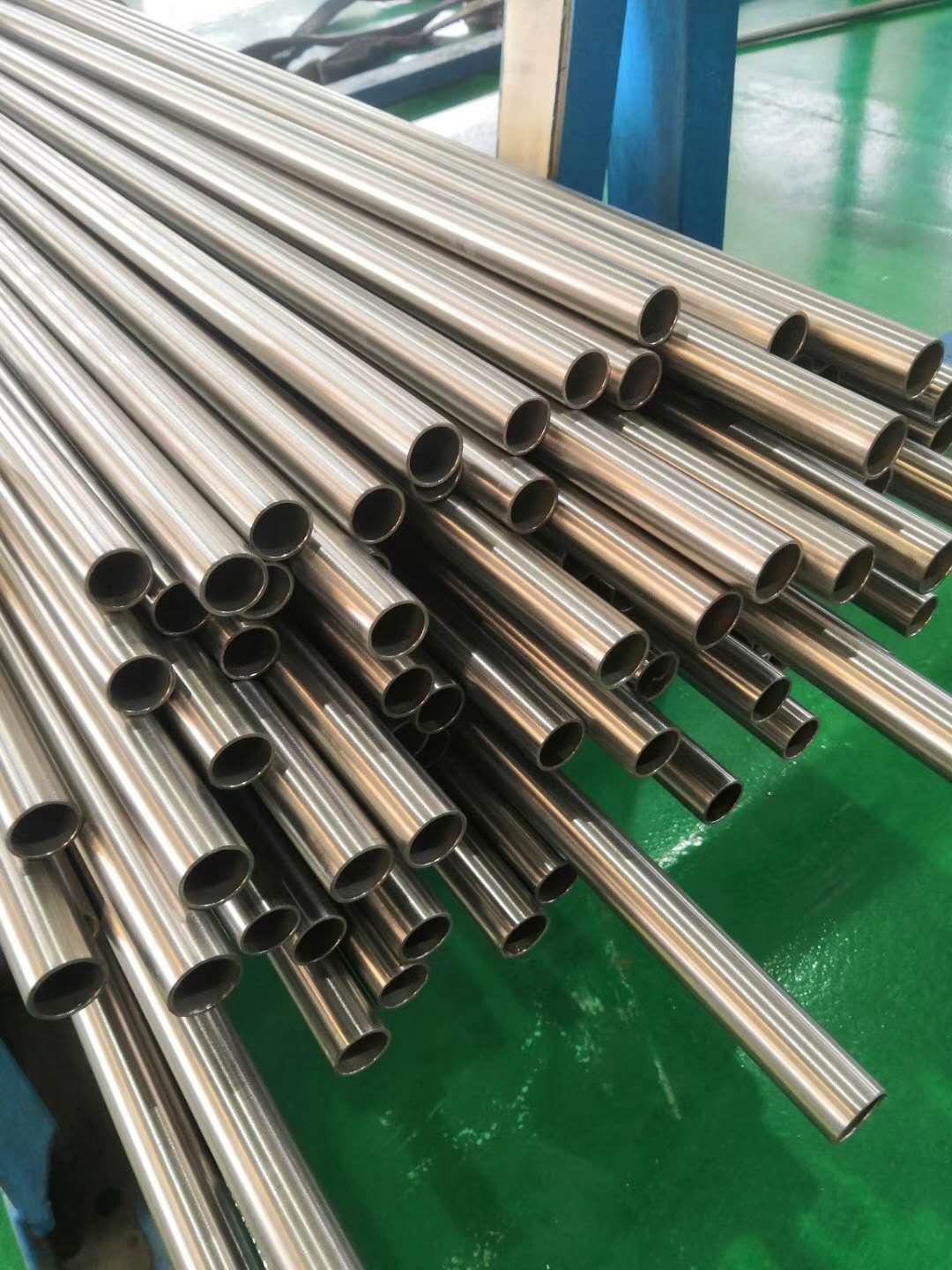 Automated titanium tube production line with CNC machines and quality testing equipment in China